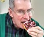 mr. ken eating a donut