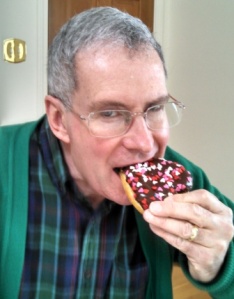 mr. ken eating a donut