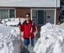 Nancy shoveling front walk
